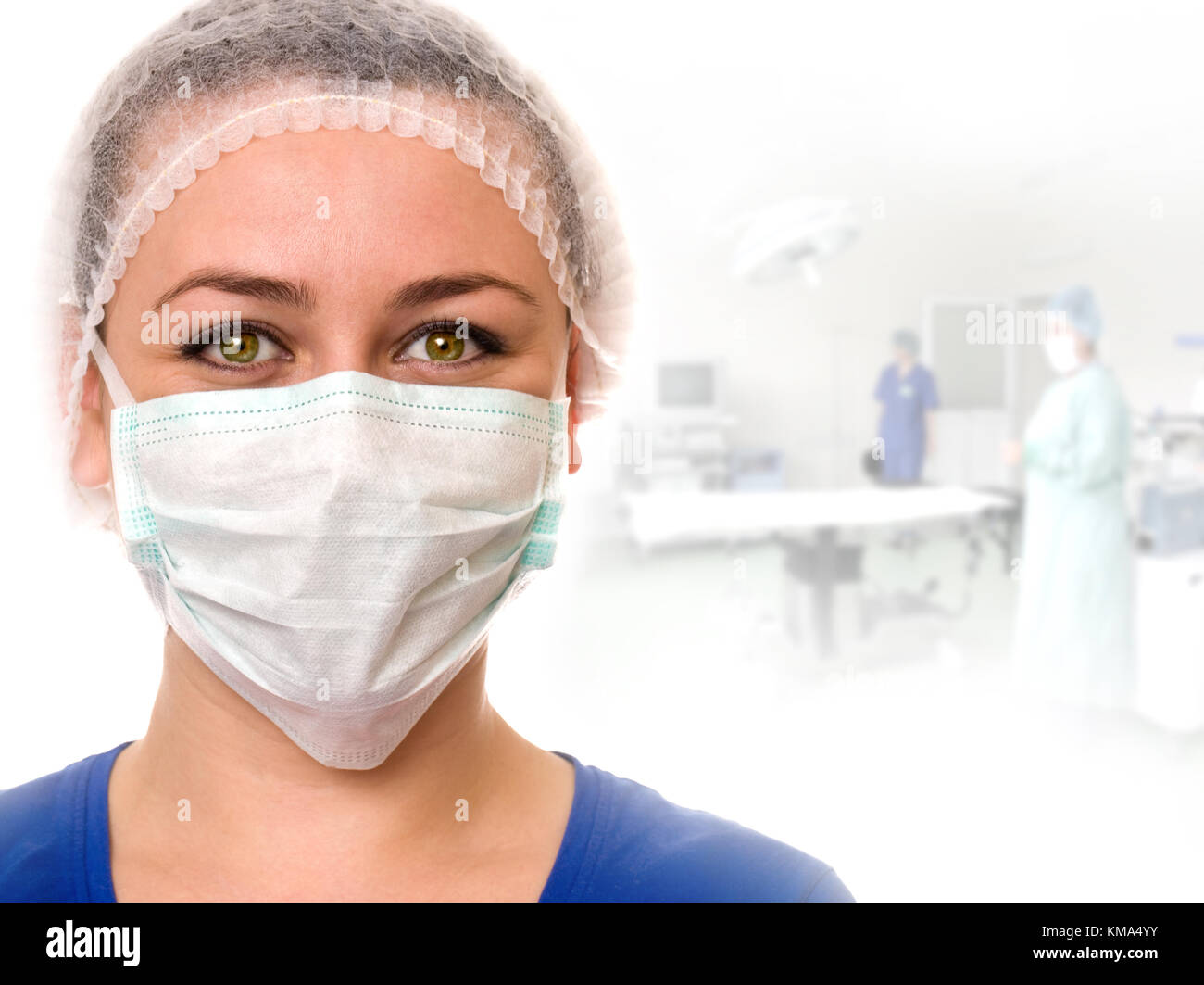 A portrait of a medical assistant while an operation takes place in the background. Stock Photo