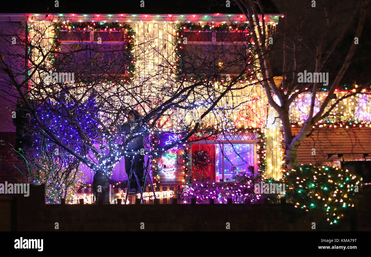 Stephen Stroughair puts up Christmas lights at his house in Tallaght