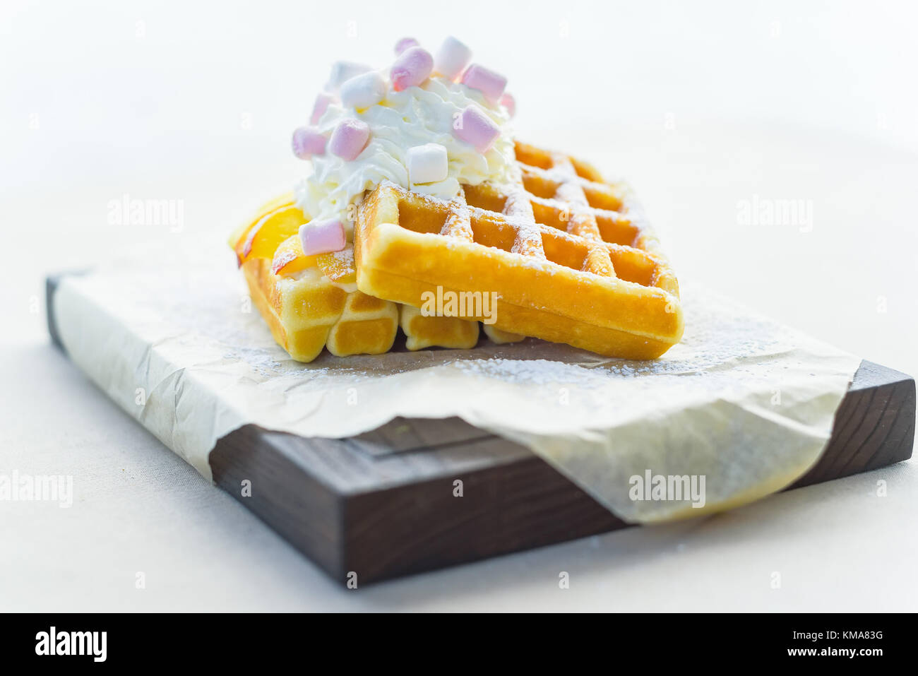 Belgian waffles with mango in restaurant Stock Photo Alamy