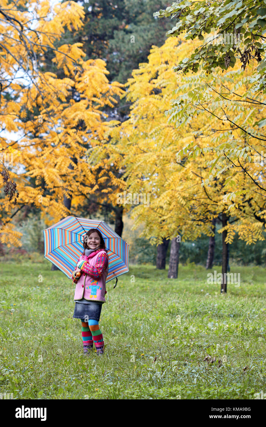 happy little girl in park autumn season Stock Photo - Alamy