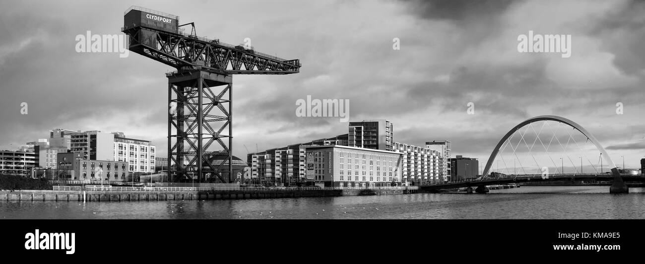 A view of the River Clyde, which features the Finnieston Crane and the Clyde Arc. Stock Photo