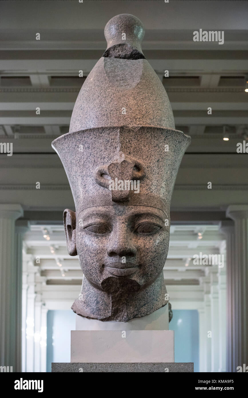 London. England. British Museum. Statue believed to be Egyptian Pharaoh Amenhotep III with double crown (Pschent), reworked to represent Ramesses II Stock Photo