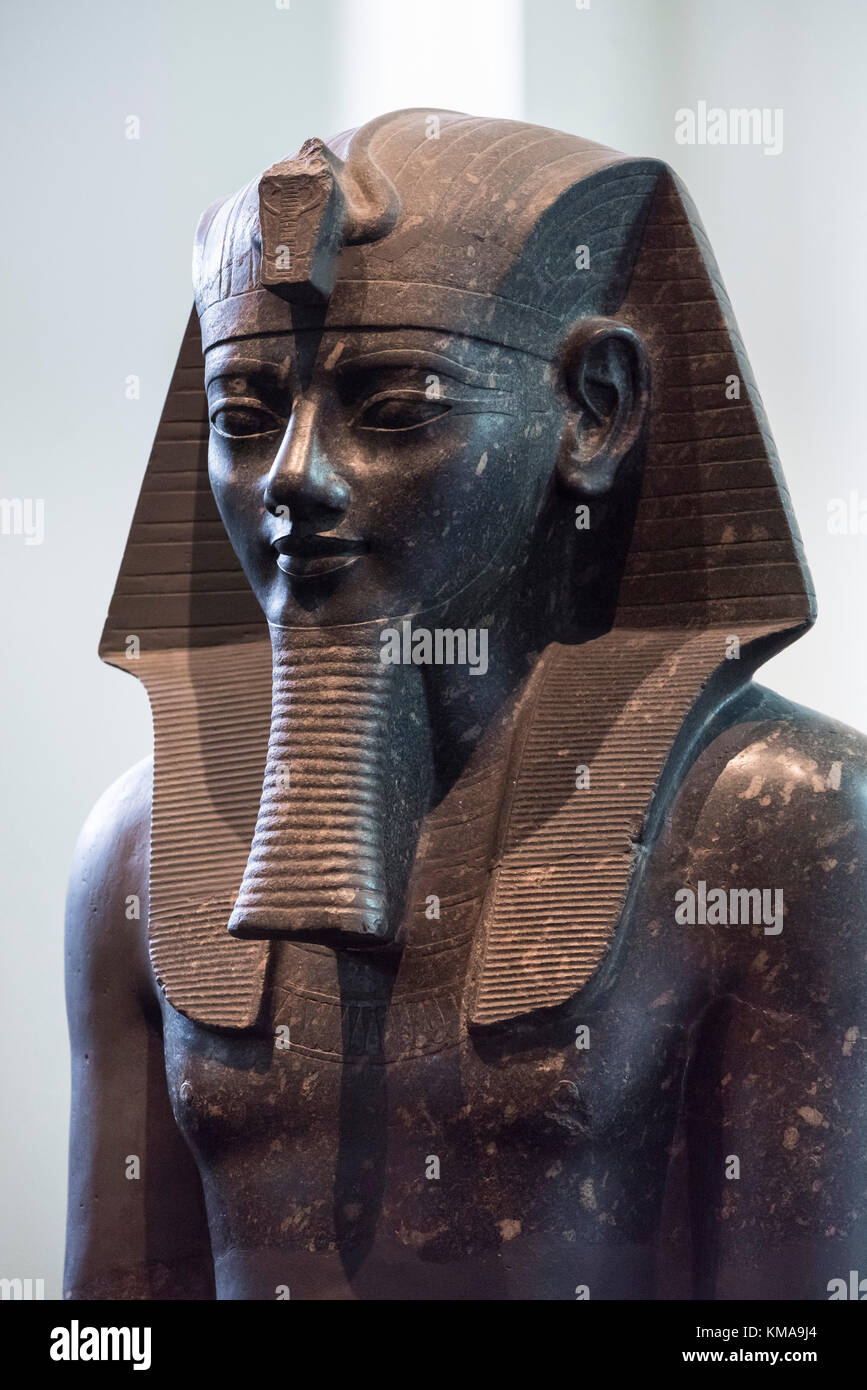 London. England. British Museum. Statue of Egyptian Pharaoh Amenhotep III wearing a Nemes. Stock Photo
