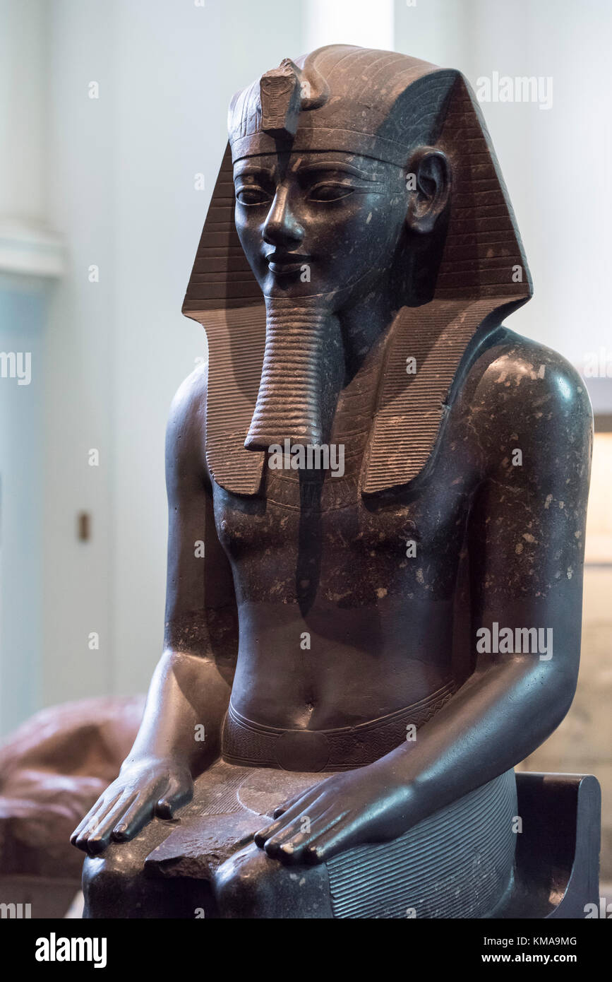 London. England. British Museum. Statue of Egyptian Pharaoh Amenhotep III wearing a Nemes. Stock Photo