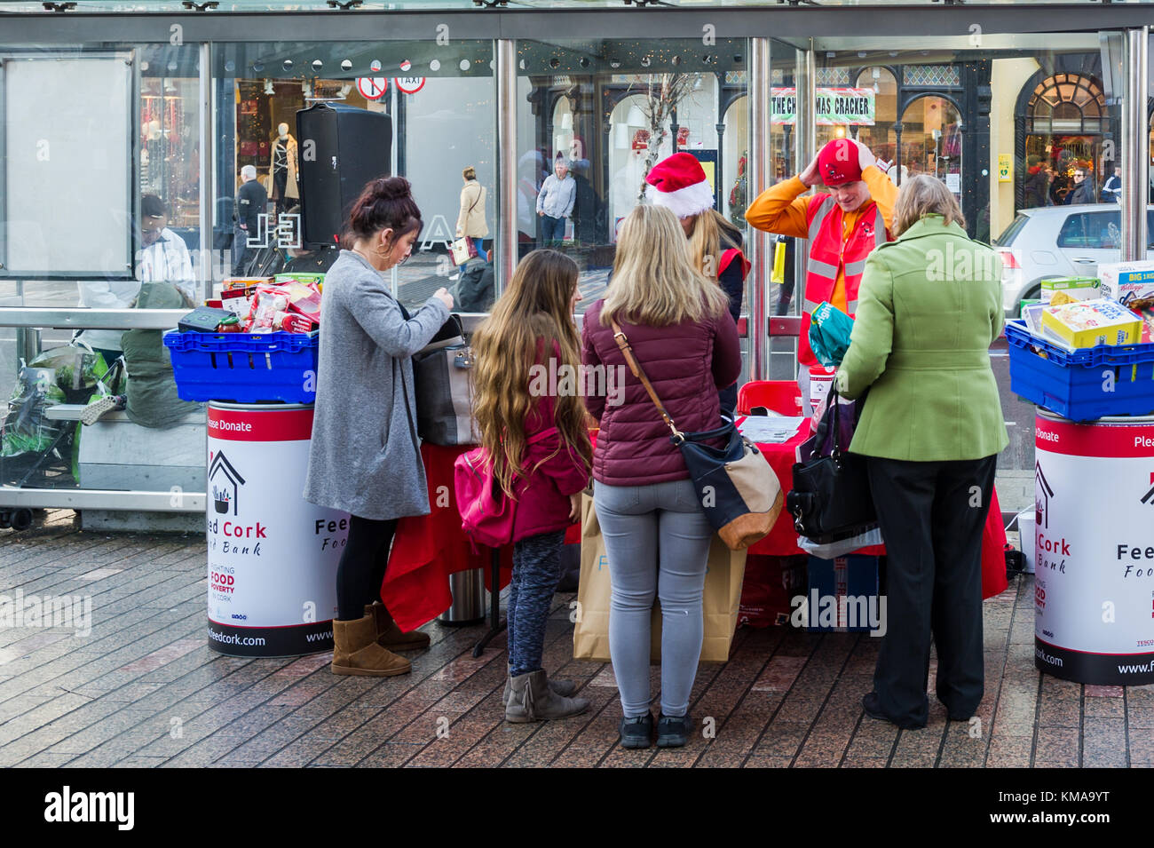 Food bank staffed by volunteers dishing out hot chocolate drinks in Patrick Street, Cork, Ireland. Stock Photo