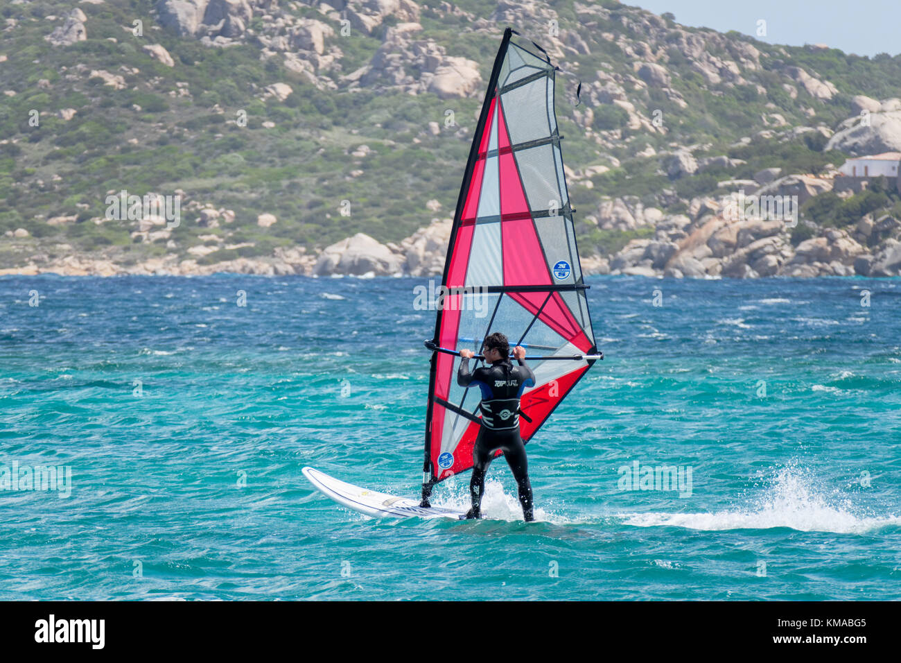 PORTO POLLO, SARDINIA/ITALY - MAY 21 : Windsurfing at Porto Pollo in Sardinia on May 21, 2015. Unidentified man Stock Photo