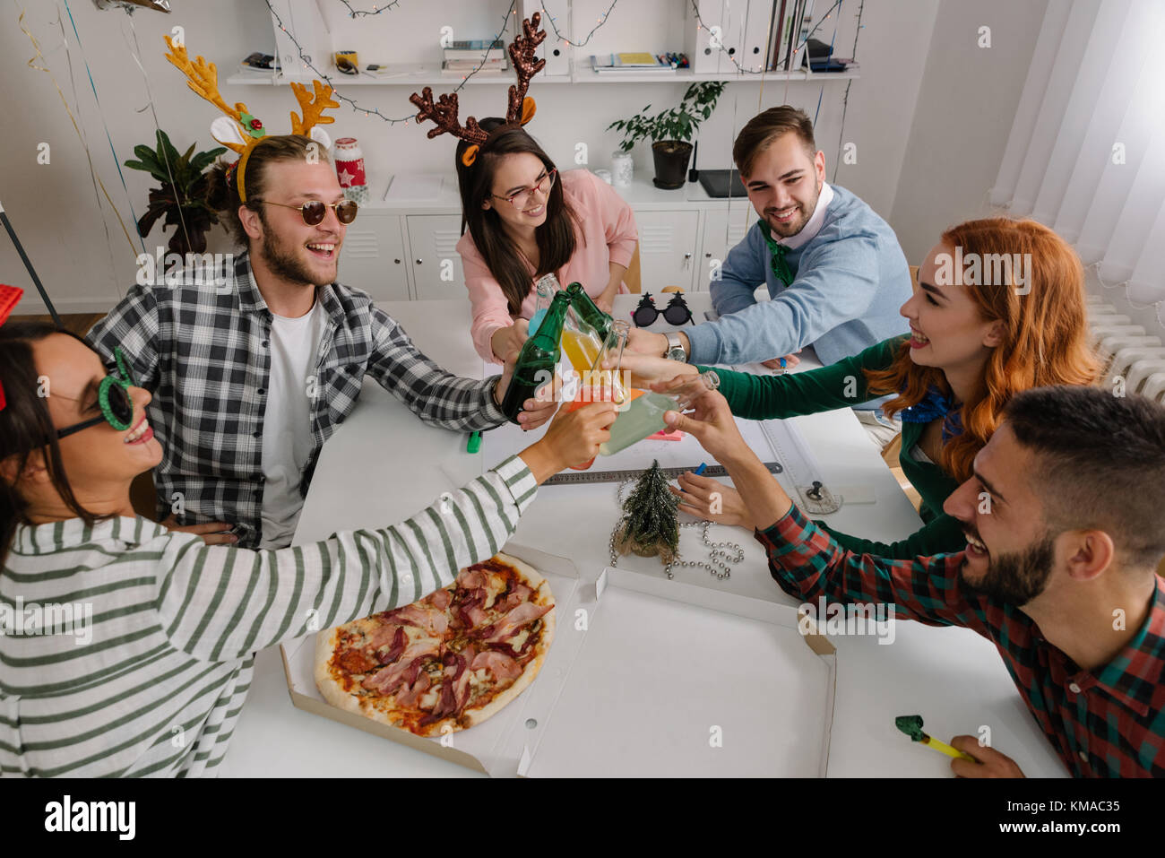 Young coworkers toasting together Stock Photo