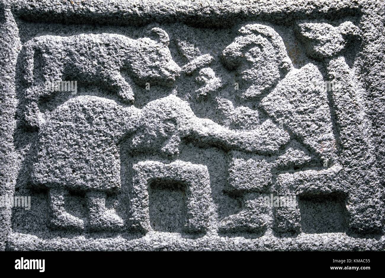Old Testament Abraham sacrifices son Isaac on altar. Carved panel of the Celtic Christian Moone Cross, County Kildare, Ireland. Stock Photo