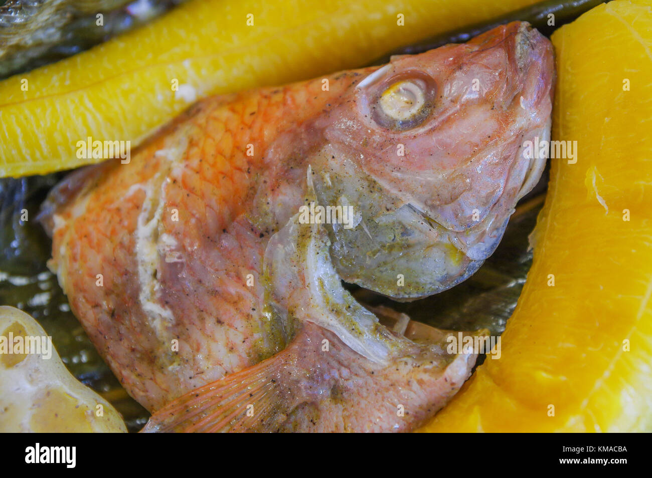 Close up of delicious typical amazonian food, fish cooked in a leaf with plantain Stock Photo