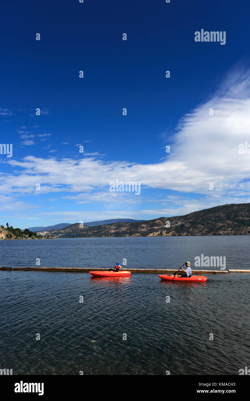 Canoeist on Lake Okanagan at Bear Creek Park, near Kelowna City, British Columbia, Canada Stock Photo