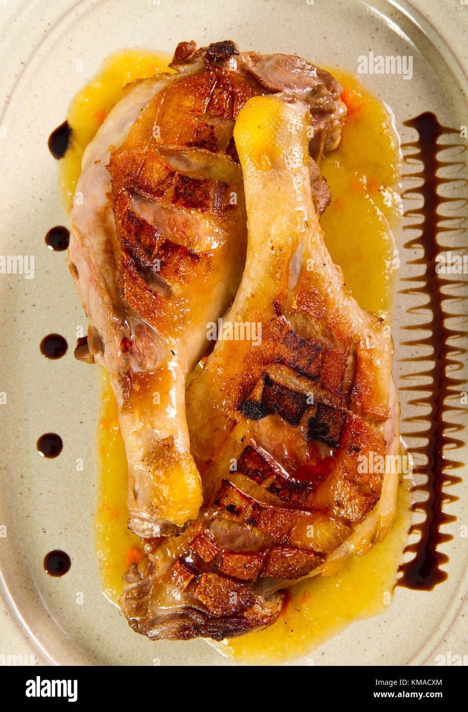 Grilled and baked duck legs Stock Photo - Alamy