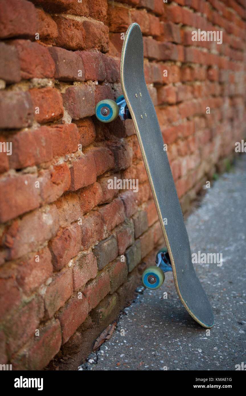 Skateboard leaning against wall Stock Photo Alamy