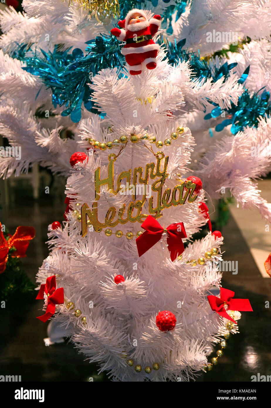 White Christmas Tree Decorated with Many Red Ornaments and Cute Santa ...