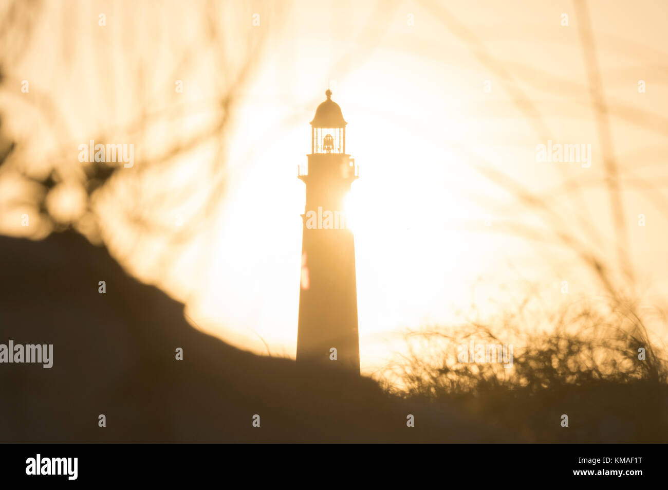 Lighthouse and setting sun at Ponce Inlet Florida Stock Photo