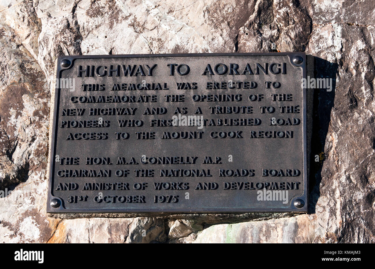 Close-up of a metal plaque commemorating the opening of  the new State Highway 80  to Mount Cook  and the pioneers who first established road access Stock Photo