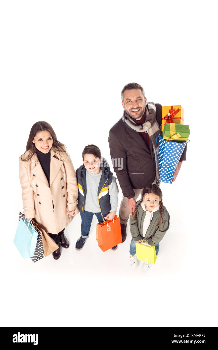 family holding shopping bags Stock Photo