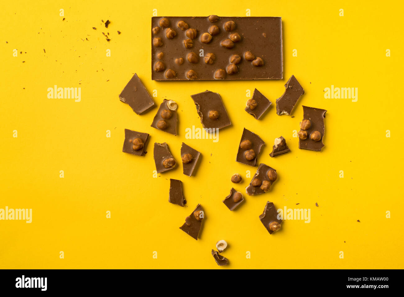 Chocolate bar with scattered pieces Stock Photo Alamy
