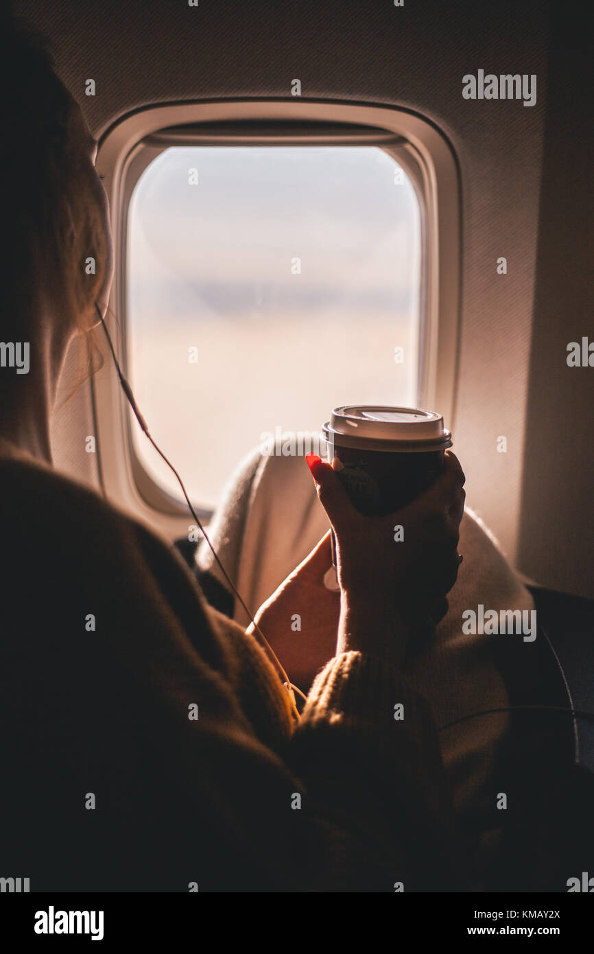 Girl flying on a plane Stock Photo