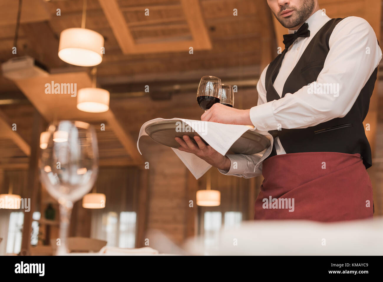 Waiter holding tray hi-res stock photography and images - Alamy