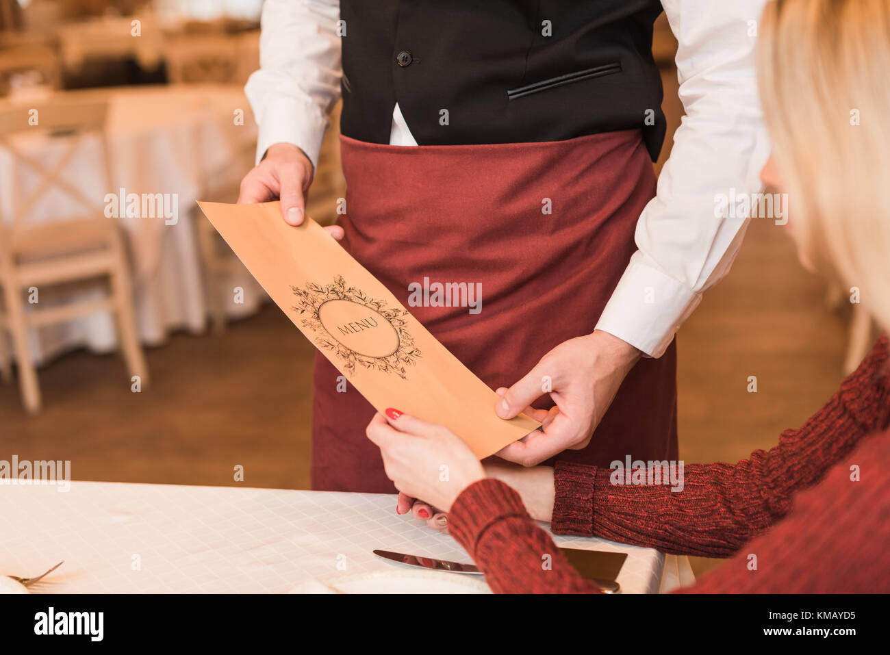 Waiter giving menu Stock Photo Alamy