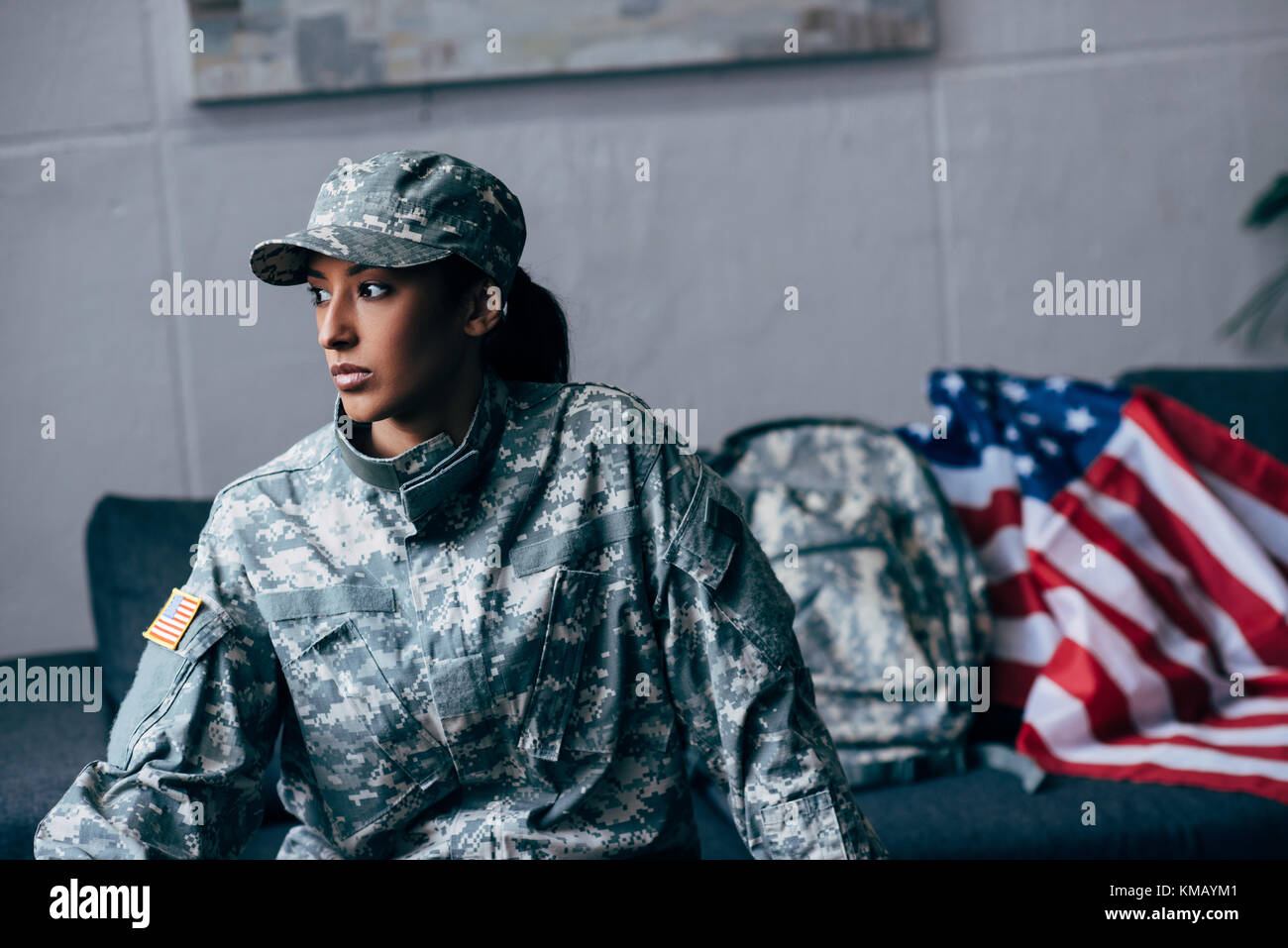 female soldier and american flag Stock Photo