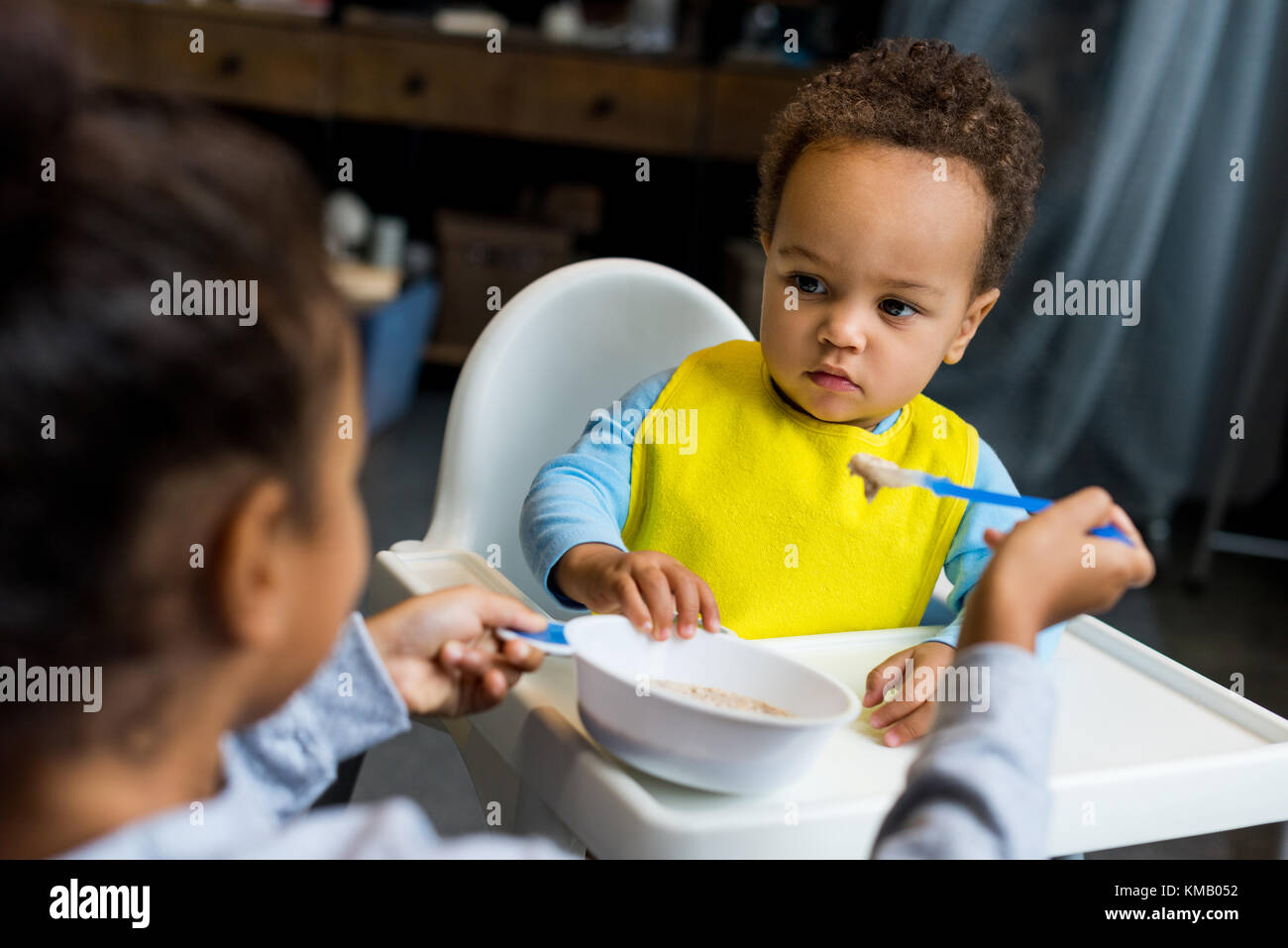 https://c8.alamy.com/comp/KMB052/african-american-sister-feeding-brother-KMB052.jpg