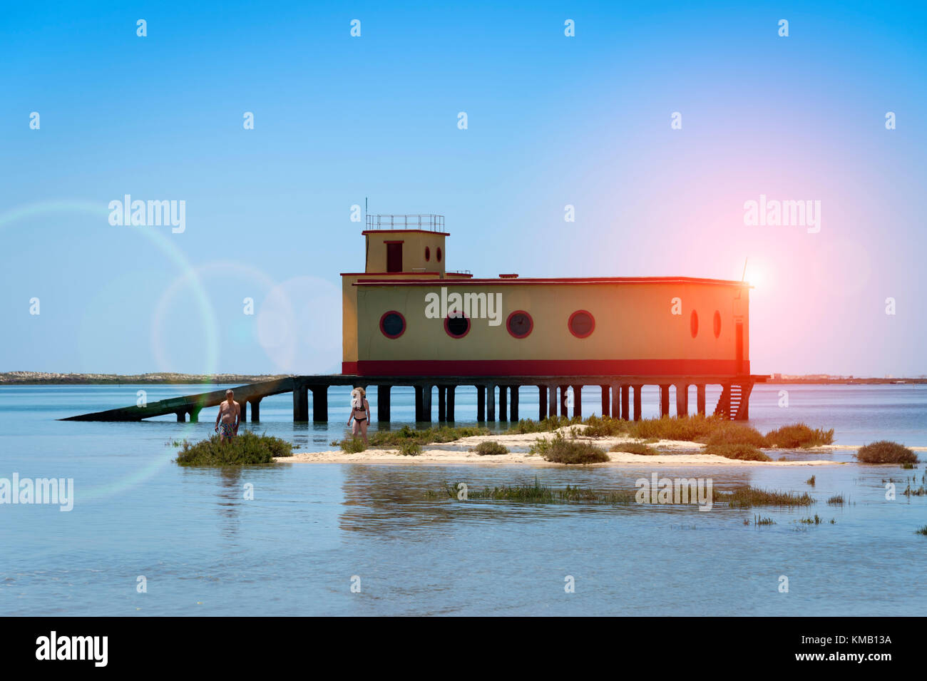 Old life guard building in Fuseta, Algarve, Portugal. Sun, lens flare. Stock Photo