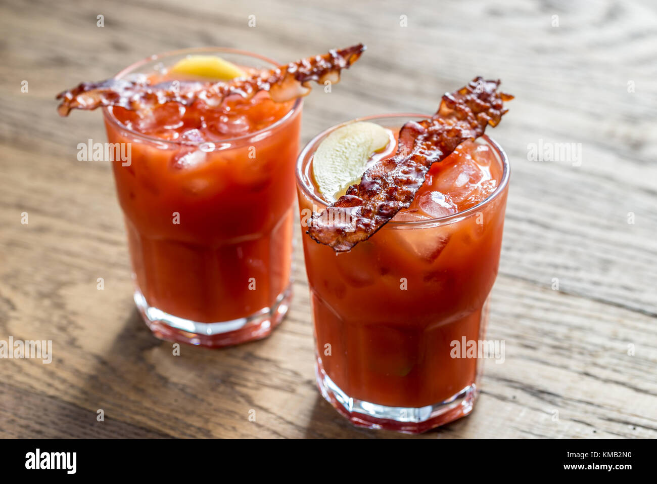 Two glasses of Bloody Mary with bacon rashers Stock Photo - Alamy