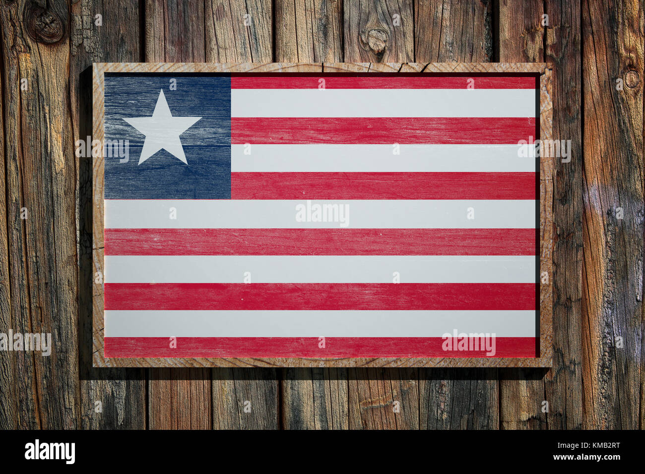 3d rendering of Liberia flag on a wooden frame over a planks wall Stock ...