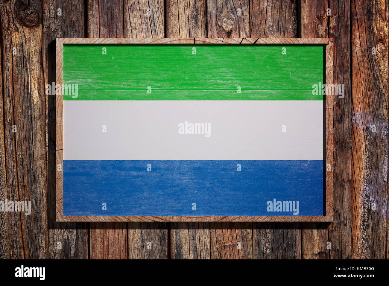 3d rendering of Republic of Sierra Leone flag on a wooden frame over a ...