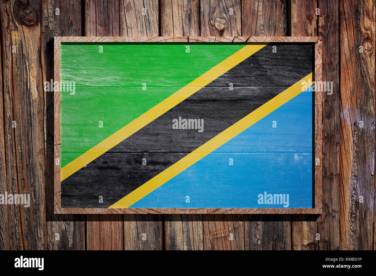 3d rendering of Tanzania flag on a wooden frame over a planks wall ...
