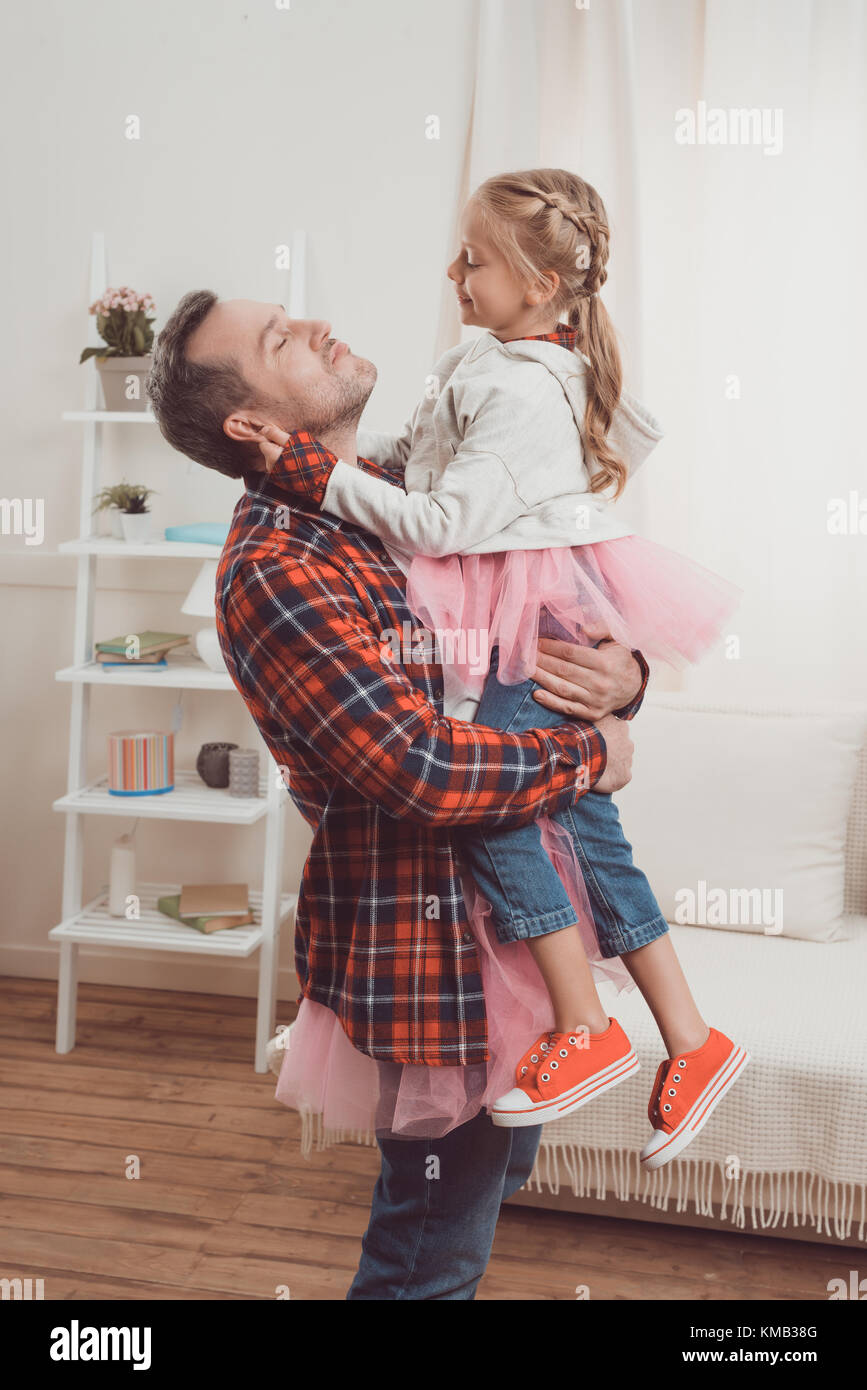 father and daughter in pink skirts Stock Photo
