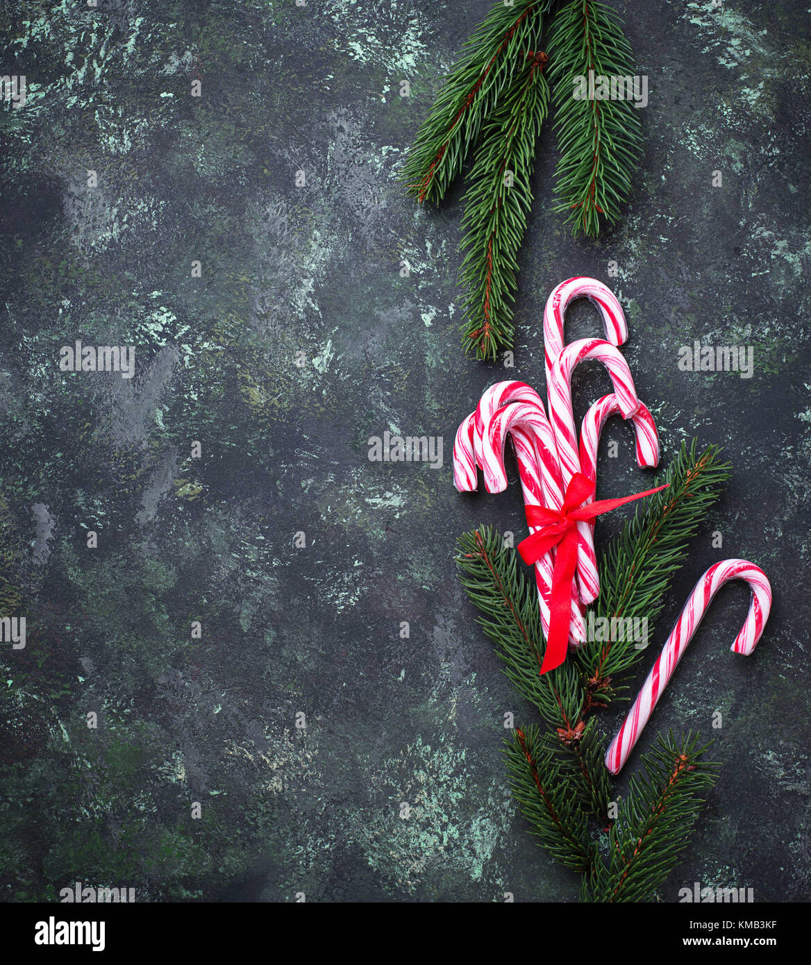 Christmas background with candy cane and fir tree branches Stock Photo ...