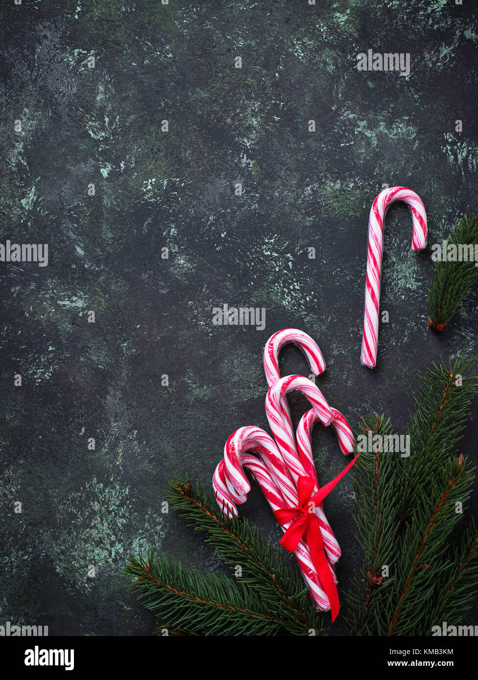 Christmas background with candy cane and fir tree branches Stock Photo
