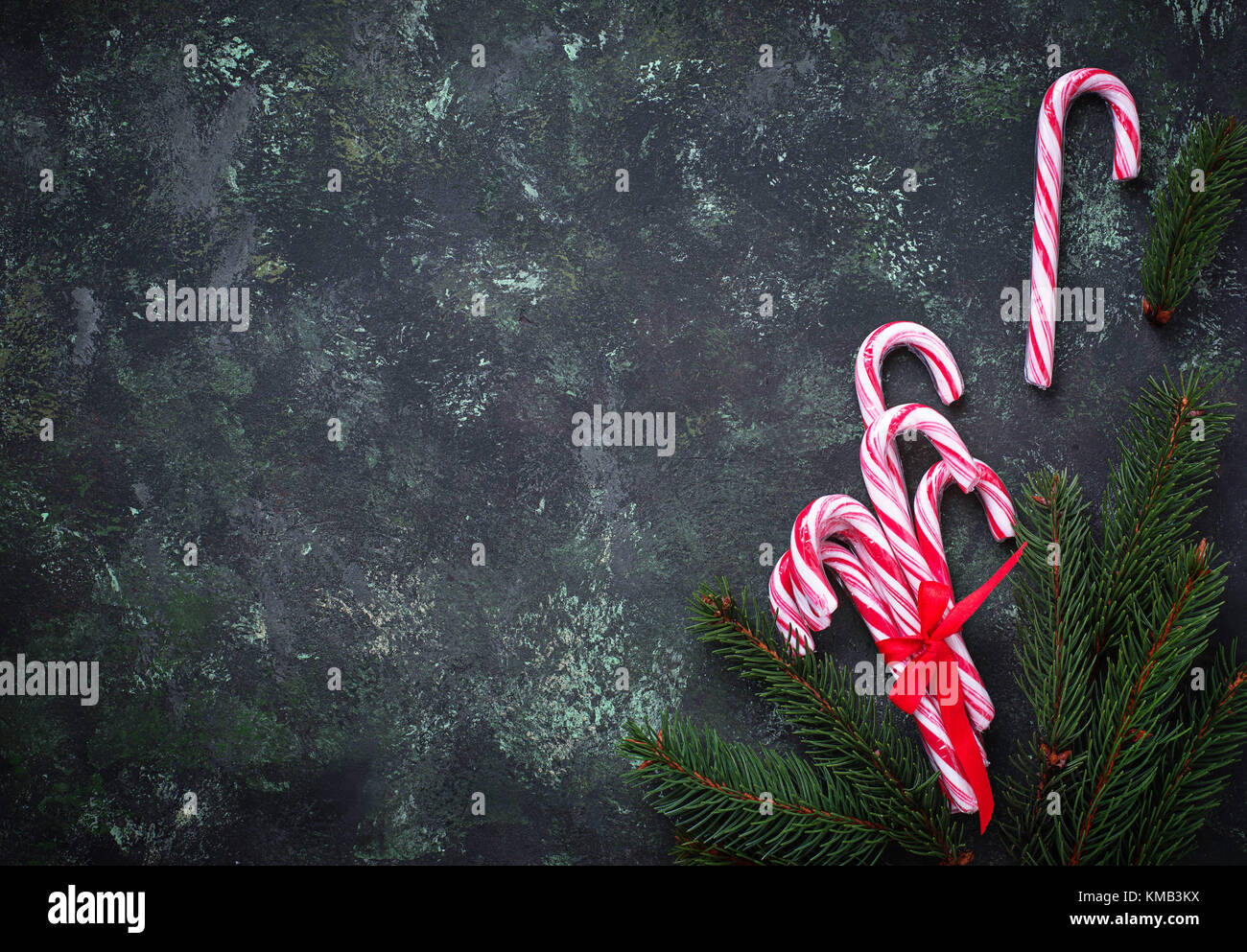 Christmas background with candy cane and fir tree branches Stock Photo ...