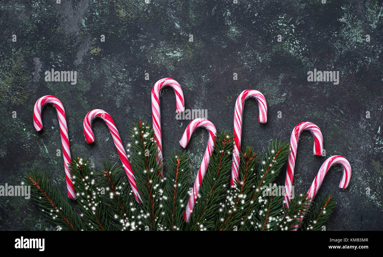 Christmas background with candy cane and fir tree branches Stock Photo ...