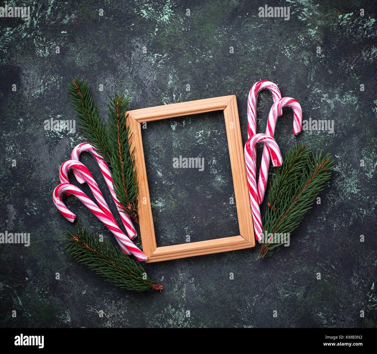 Christmas background with candy cane and fir tree branches Stock Photo ...