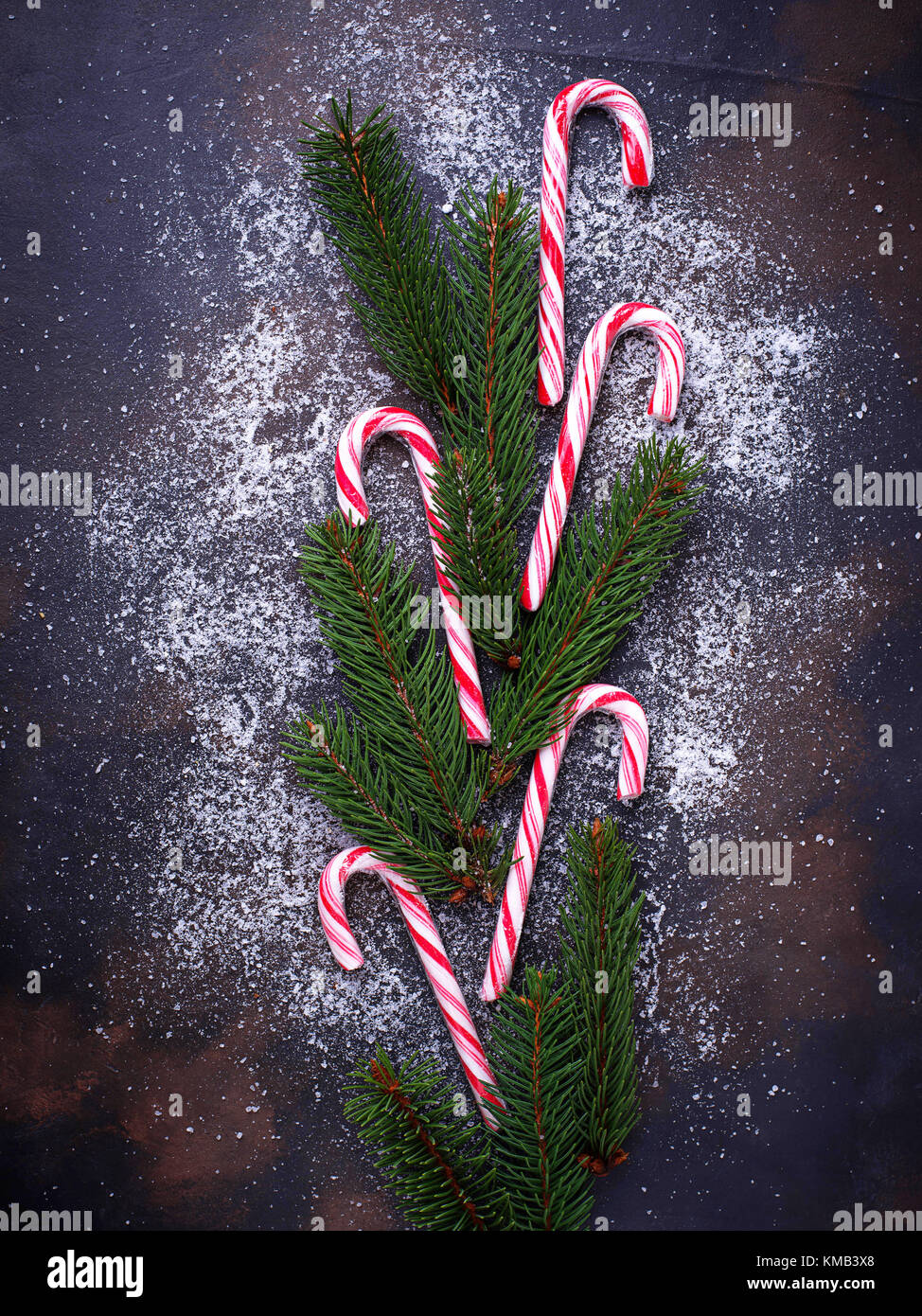 Christmas background with candy cane and fir tree branches Stock Photo ...
