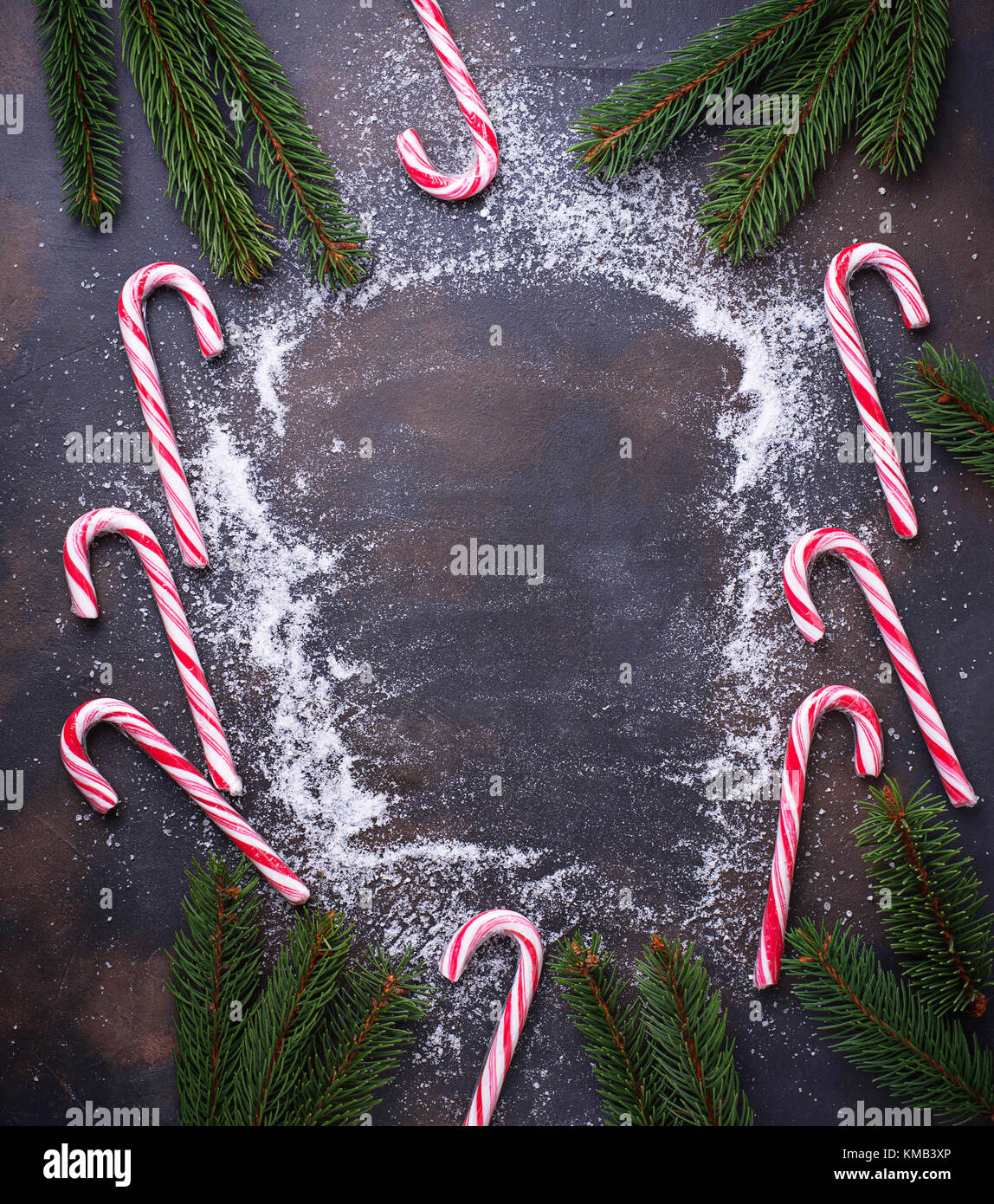 Christmas background with candy cane and fir tree branches Stock Photo ...