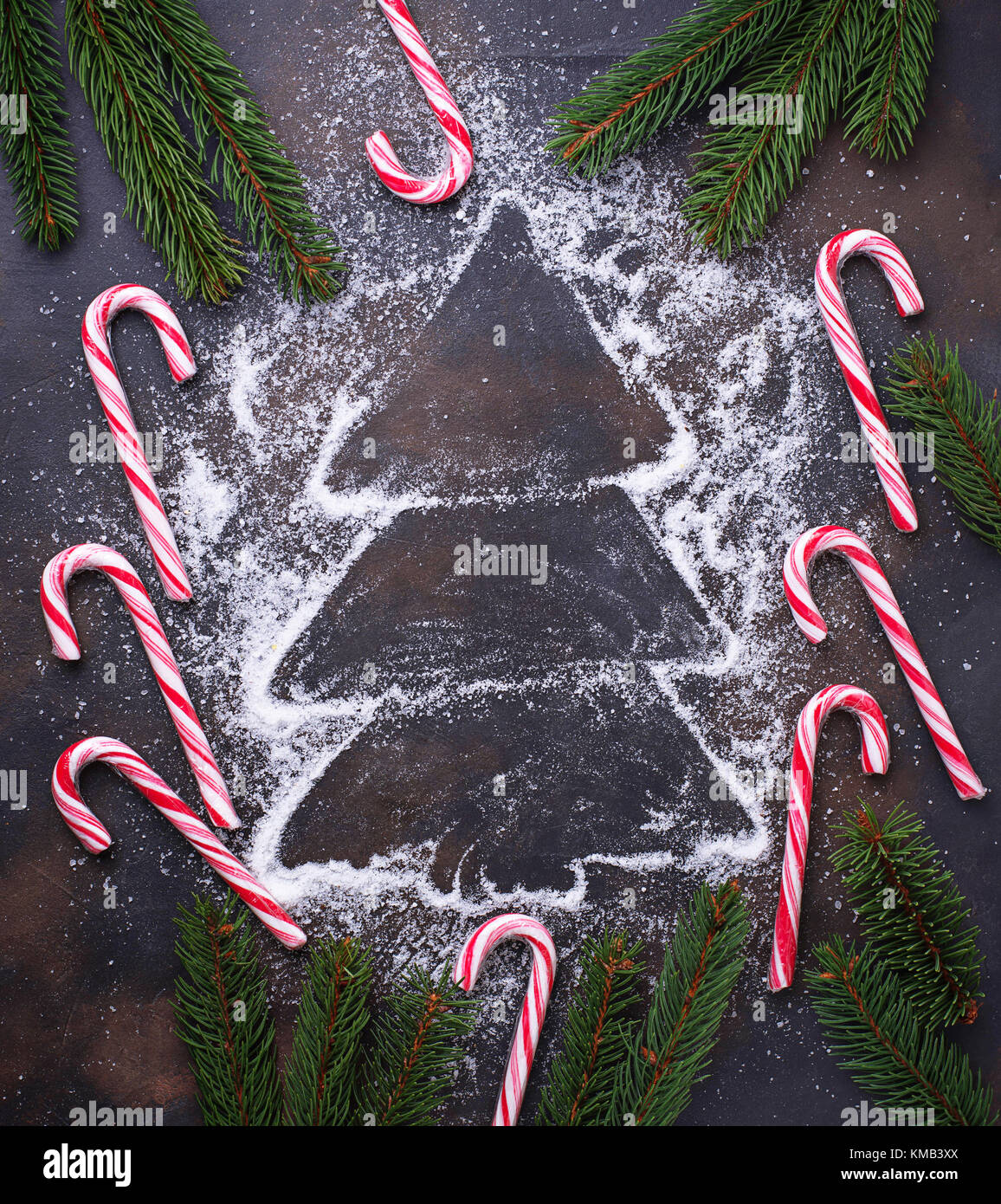 Christmas background with candy cane and fir tree branches Stock Photo ...