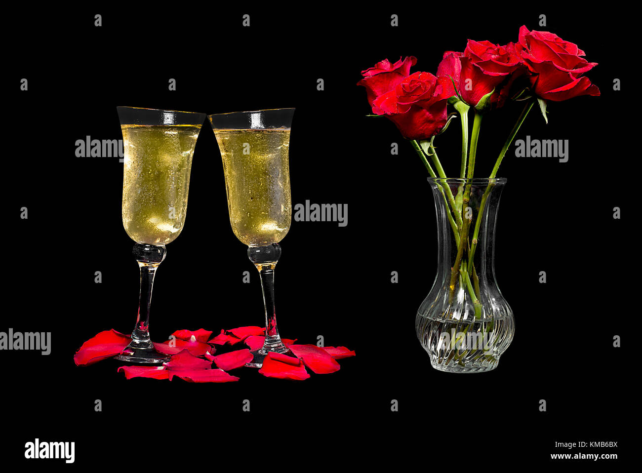 Champagne toast with roses on black background Stock Photo - Alamy