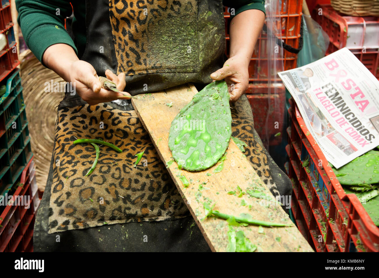 Nopales, Opuntia cacti, being prepared for sale in Mexico City's Mercado de la Merced. Stock Photo