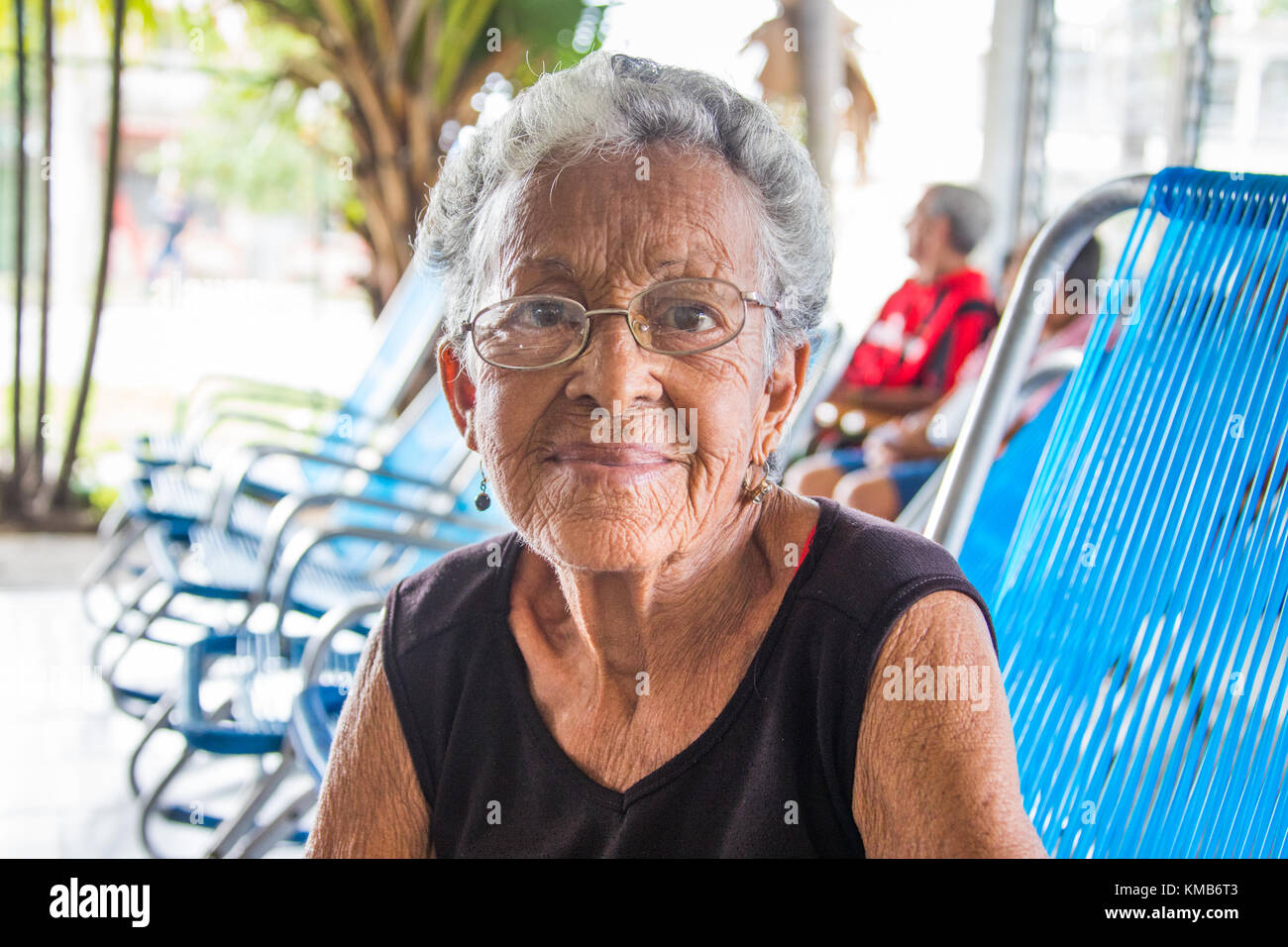 Cuban woman relaxing at an Elderly Care Facility or Nursing Home in Cienfuego, Cuba Stock Photo