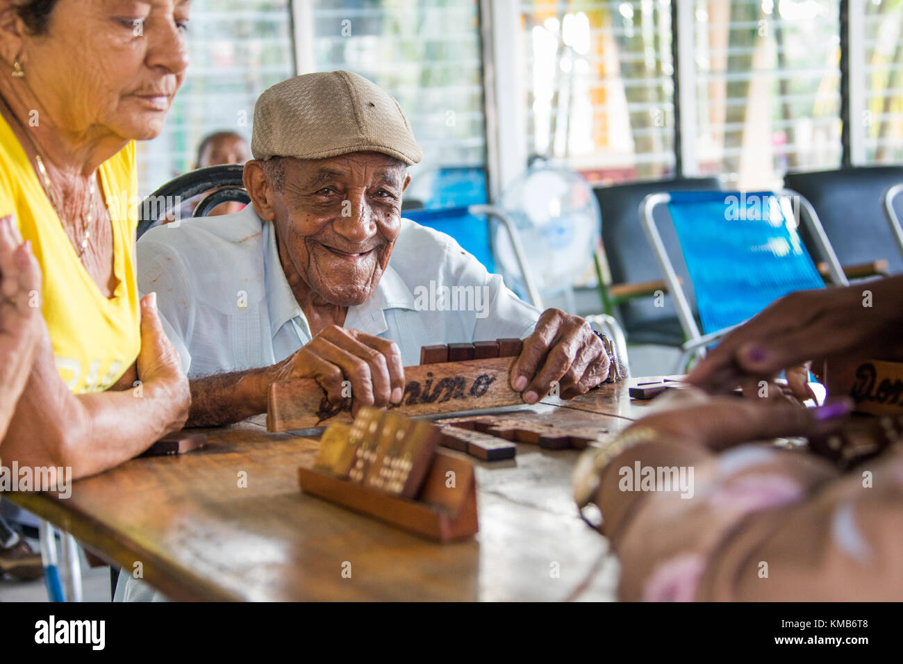 Playing dominos in an Elderly Care Facility or Nursing Home in Cienfuego, Cuba Stock Photo