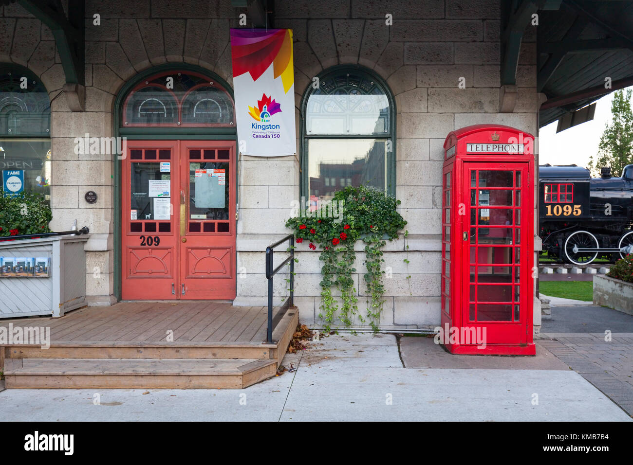 A K6 British telephone booth in front of the K & P Railway Station that is now a Tourist Information Centre in Kingston, Ontario, Canada. Stock Photo