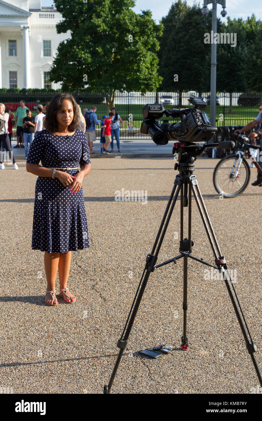 Television reporter on Pennsylvania Avenue NW outside the White House,  Washington DC, United States. Stock Photo