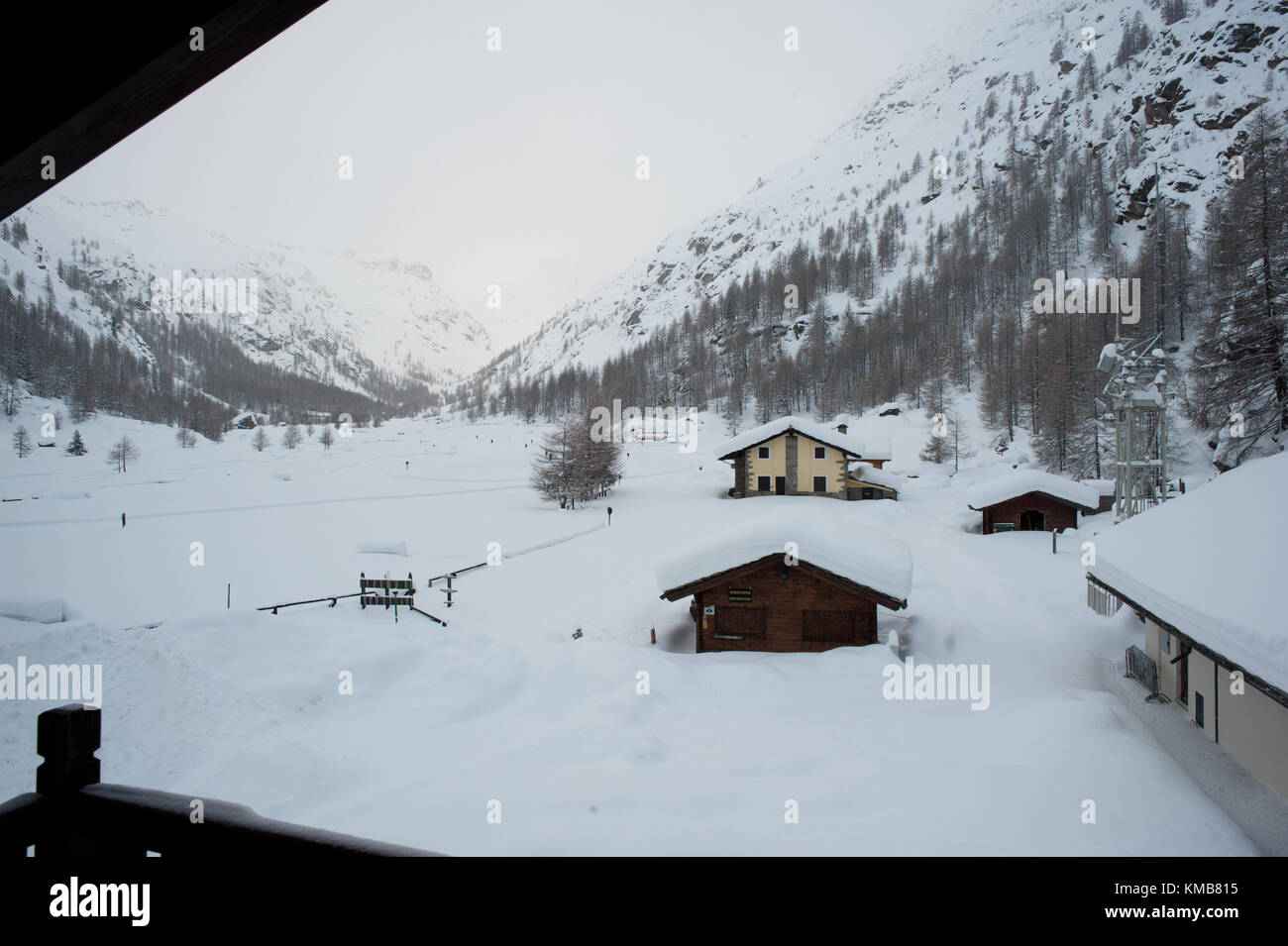High snow on the houses roof of a valley viewpoint. Pont, Valsavarenche