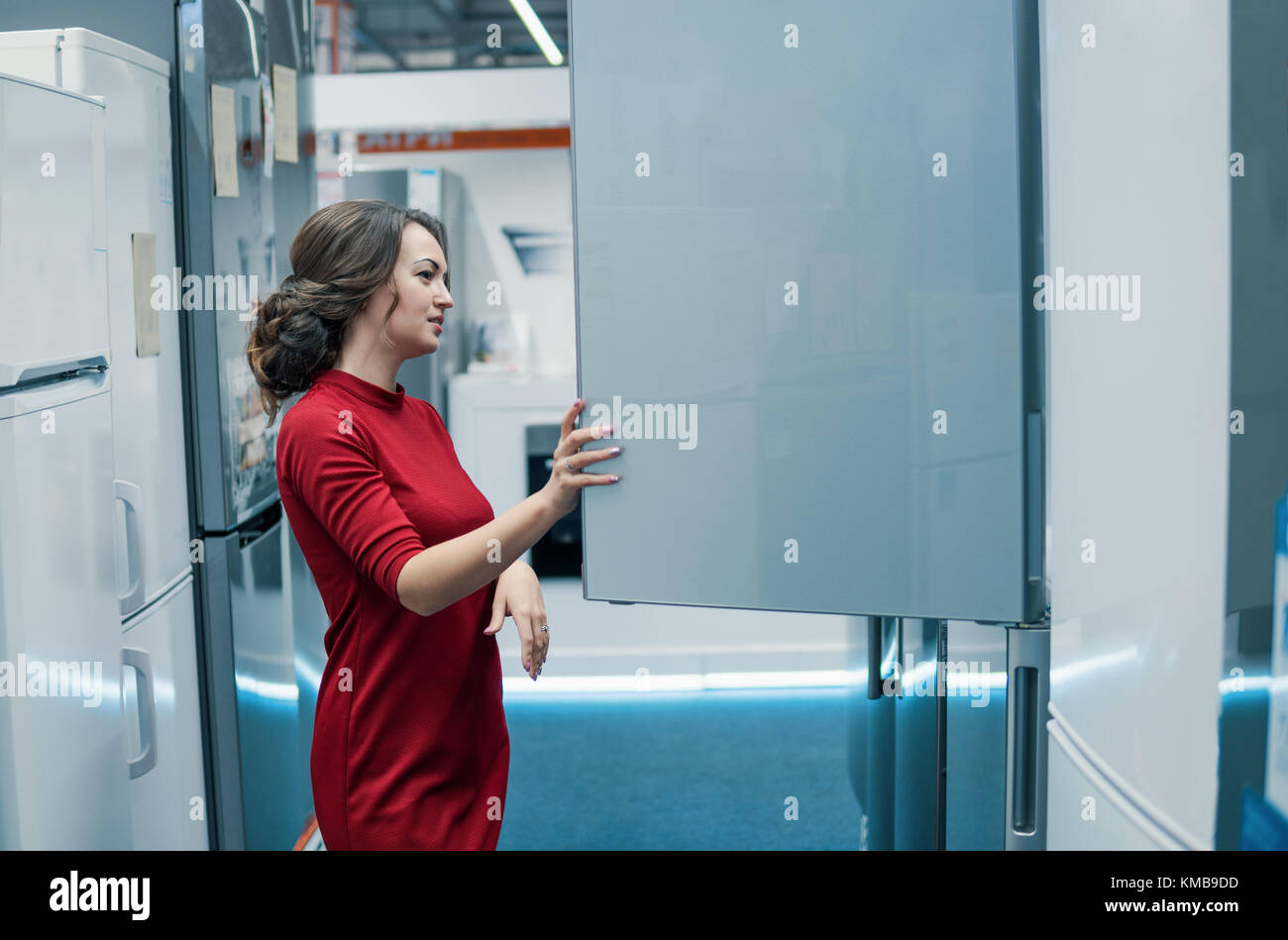 customer choosing large fridges in domestic appliances section Stock Photo