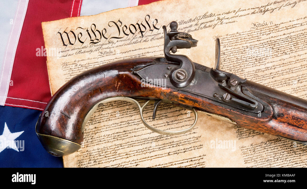 We the People with antique flintlock pistol and American flag. Stock Photo