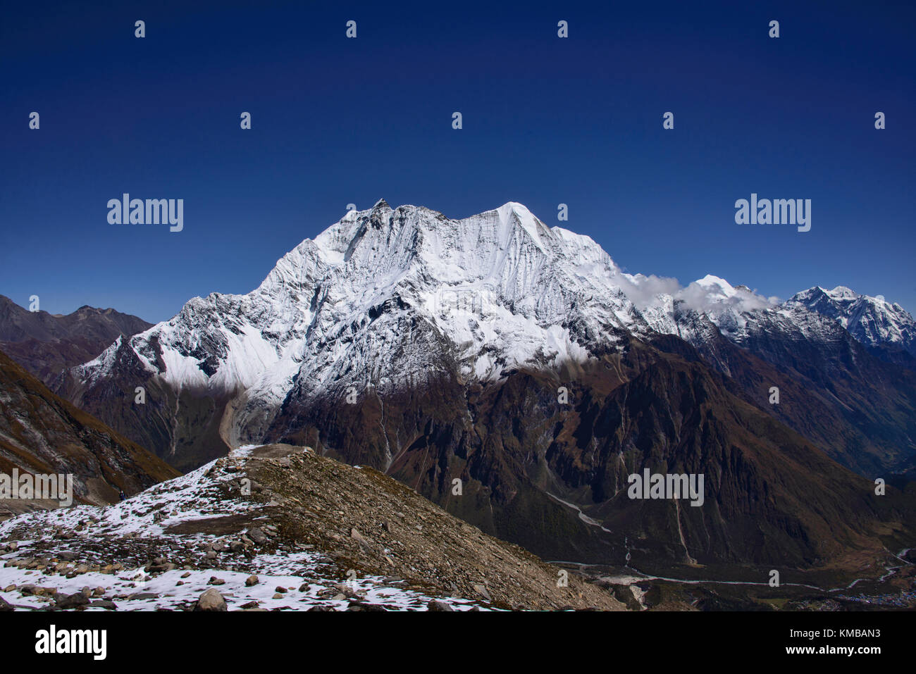Looking out at Birendra Tal and Kutang Himal on the Tibetan border from the Manaslu Basecamp trail, Nepal Stock Photo